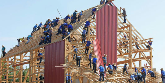 people building structure during daytime